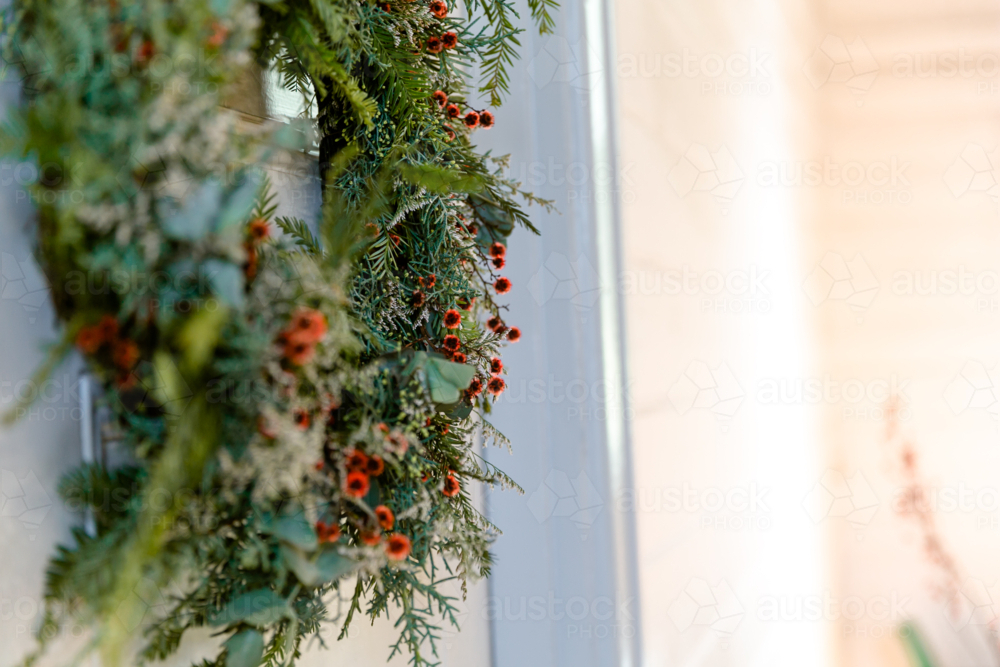 Side view of a hanging Christmas wreath - Australian Stock Image