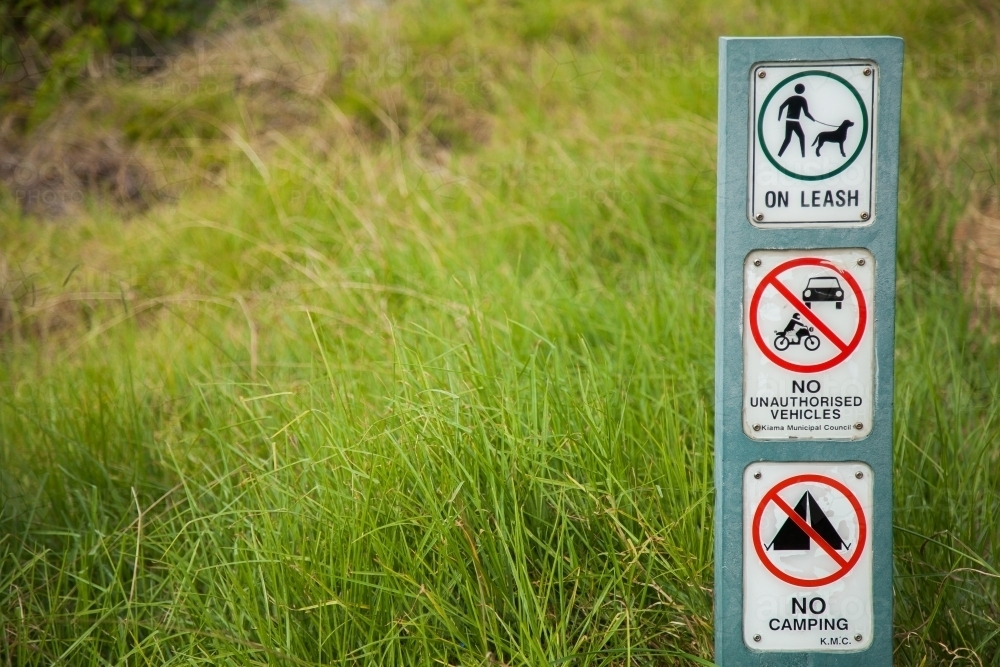 Sign along bushwalking track, no camping, no vehicles - Australian Stock Image