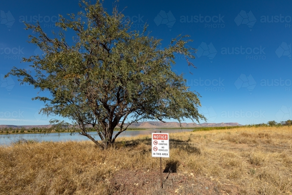 sign in picturesque location prohibiting camping and vehicles - Australian Stock Image