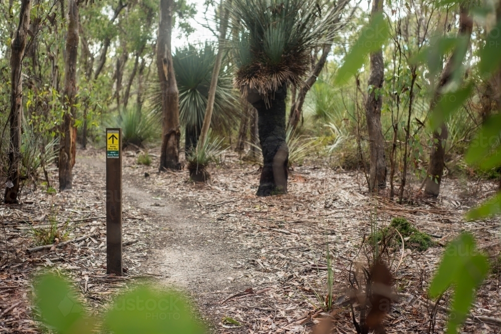 Sign on wooden post along bushwalking trail - Australian Stock Image