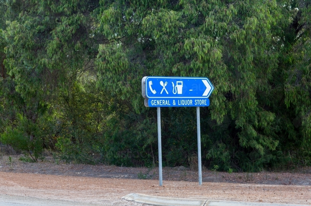 Sign showing direction to store and liquor store - Australian Stock Image