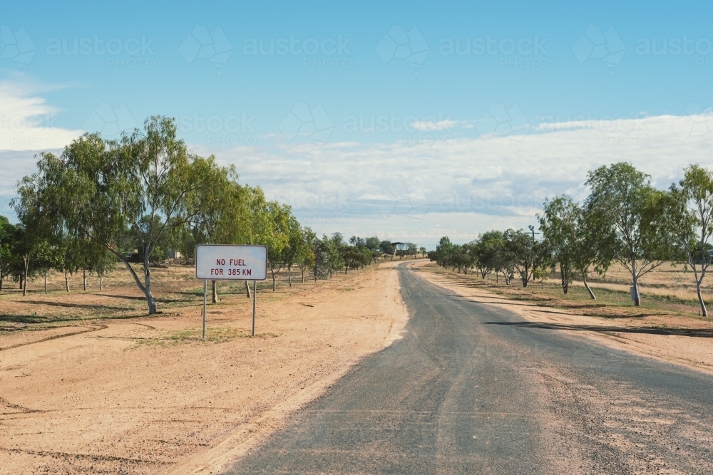 Sign warning of limited fuel in outback Northern Territory - Australian Stock Image