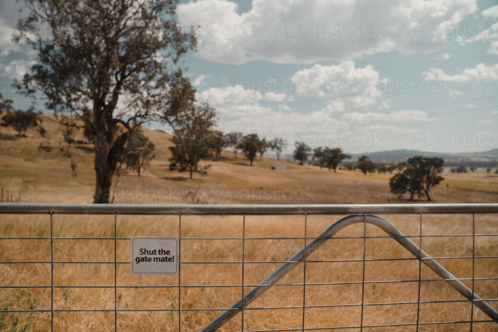 Signage on a wire farm gate in regional Australia - Australian Stock Image