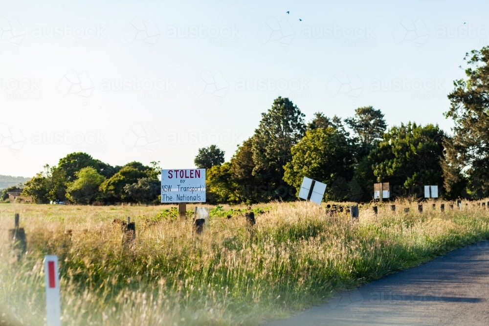 Signs protesting forced land acquisition for Singleton Bypass - Australian Stock Image