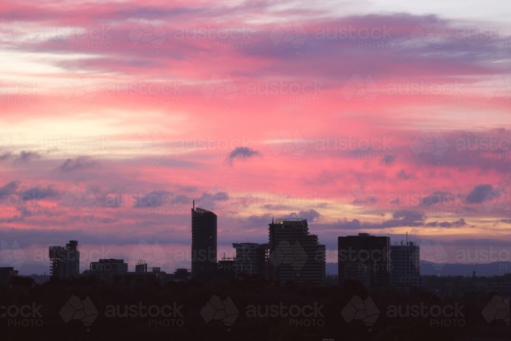 Silhouette of a city at sunset - Australian Stock Image