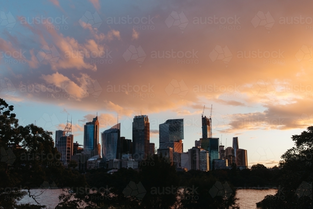 Silhouette shot of tall buildings during sunrise - Australian Stock Image