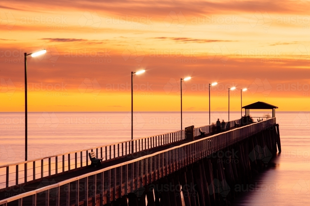Silhouette showing the structure of the Grange Jetty in Gulf St Vincent - Australian Stock Image