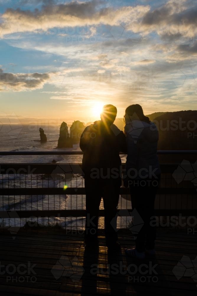 silhoutte of tourists enjoying the sunset at the 12 Apostles, Great Ocean Rd, Victoria, Australia - Australian Stock Image
