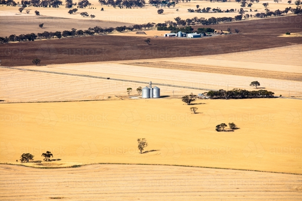 Silos and agricultural land in the Wimmera area of Western Victoria - Australian Stock Image