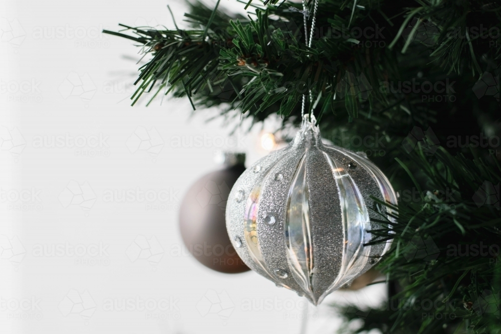 Silver Glass Bauble on Christmas Tree - Australian Stock Image