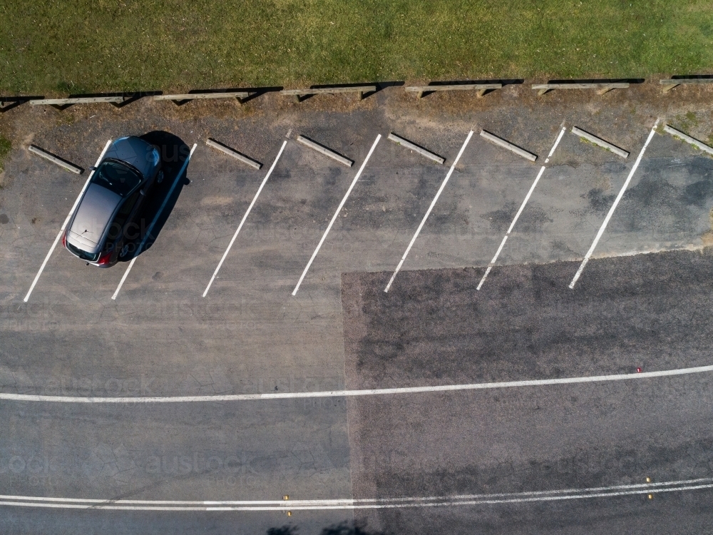 Image Of Single Car Parked In Angled Parking Space Seen From Above image-of-single-car-parked-in-angled-parking-space-seen-from-above