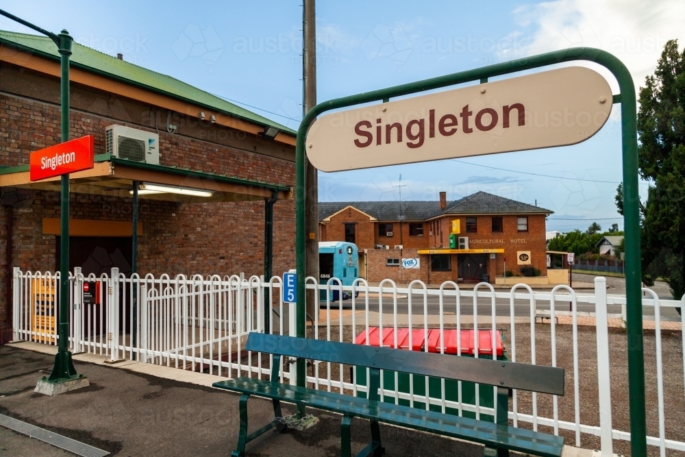 Singleton train station sign in dawn light at early commute - Australian Stock Image