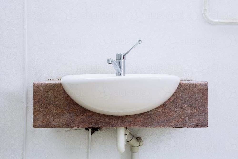 Sink in an outdoor public toilet - Australian Stock Image