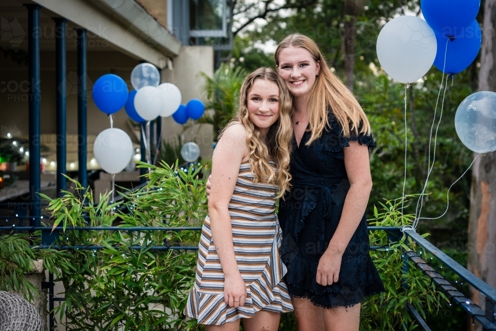 sisters at an 18th birthday party - Australian Stock Image