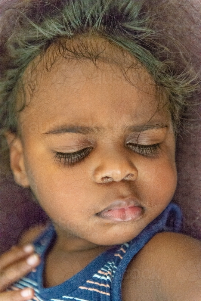Sleeping aboriginal child - Australian Stock Image