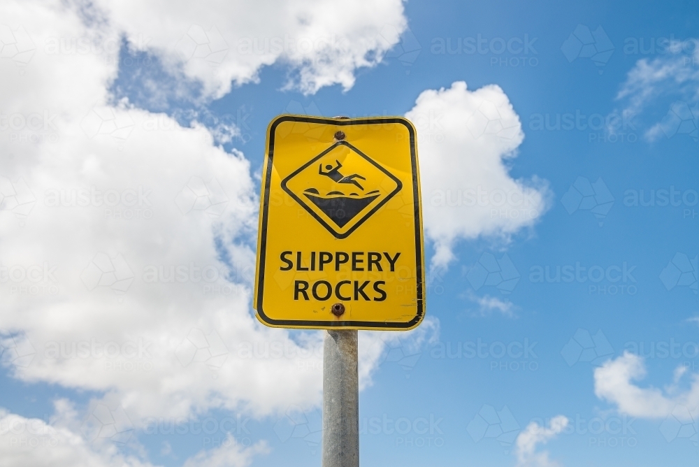 Slippery Rocks sign against sky - Australian Stock Image