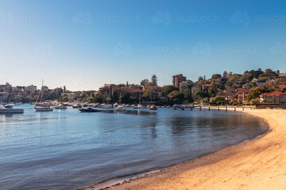 Small beach with boats in Sydney's eastern suburbs - Australian Stock Image