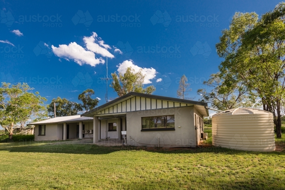 small house with watertank - Australian Stock Image