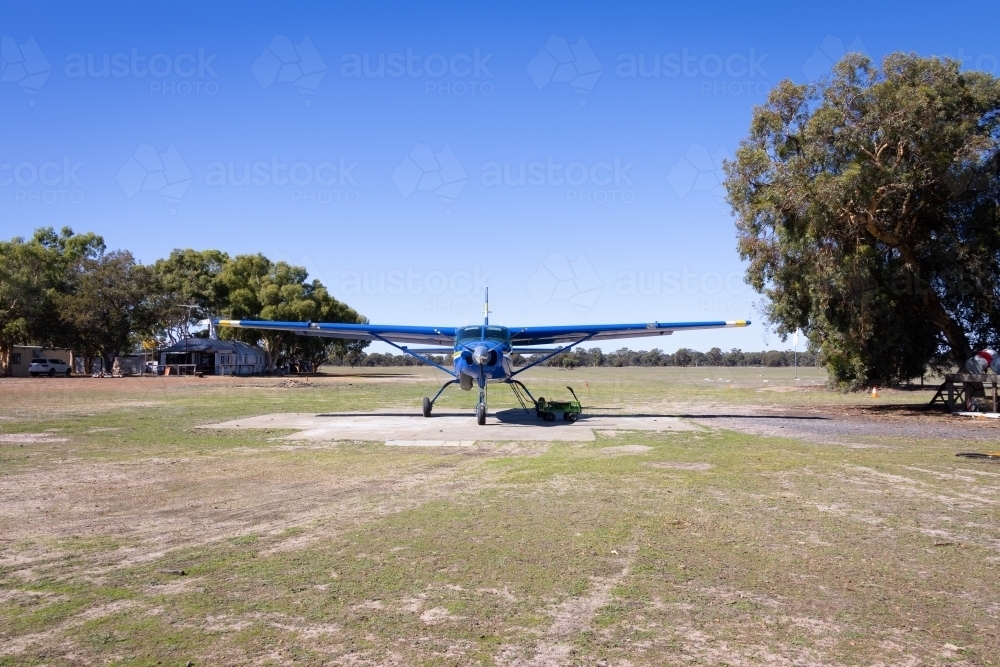 small plane parked at country airstrip - Australian Stock Image