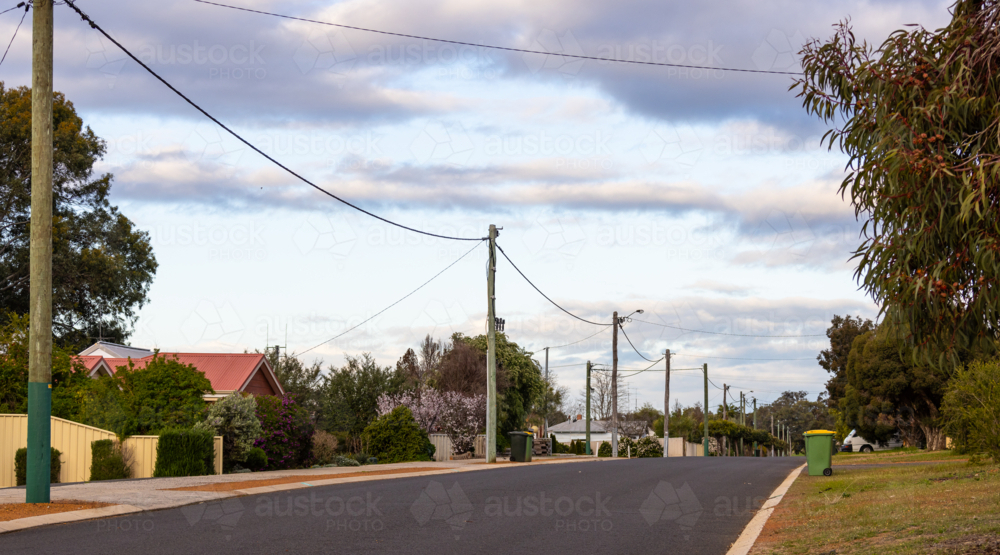 small town streetscape with above ground power and wheelie bins - Australian Stock Image