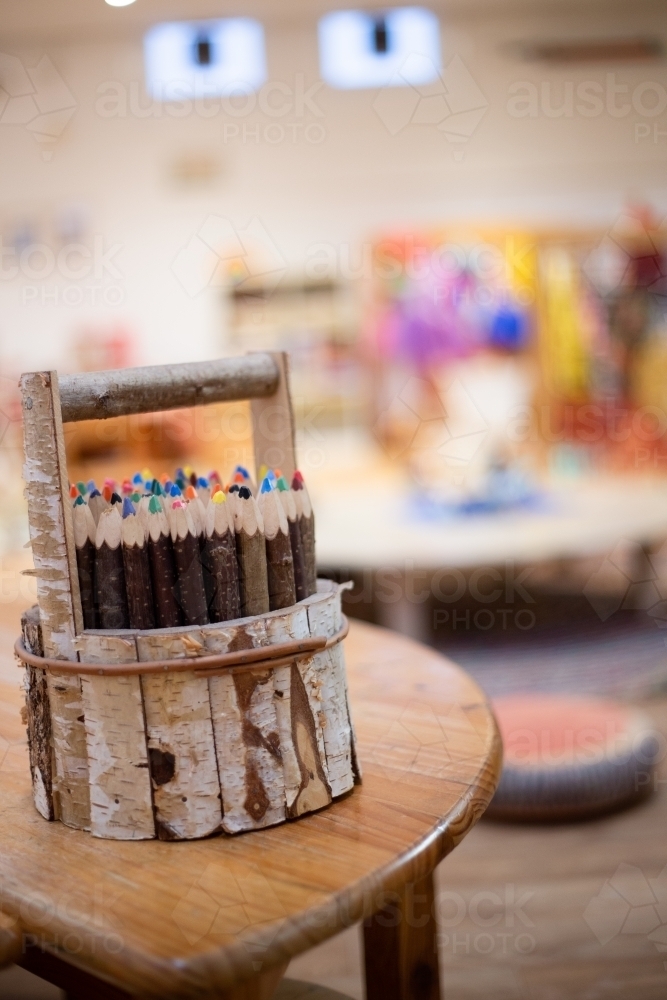 Small wooden bucket holding pencils - Australian Stock Image