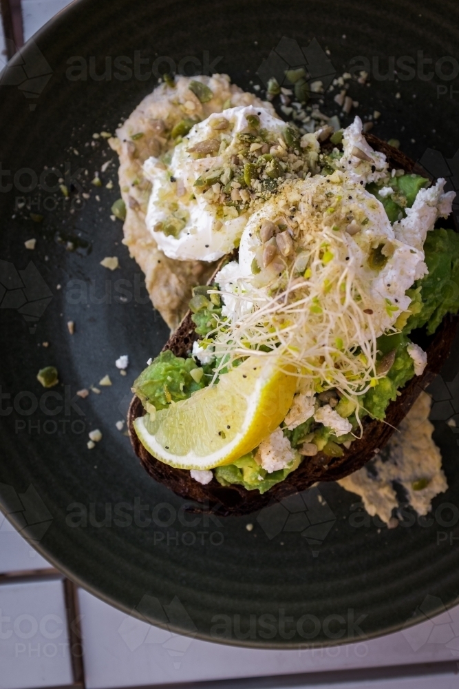 smashed avo on toast with a poached egg - Australian Stock Image
