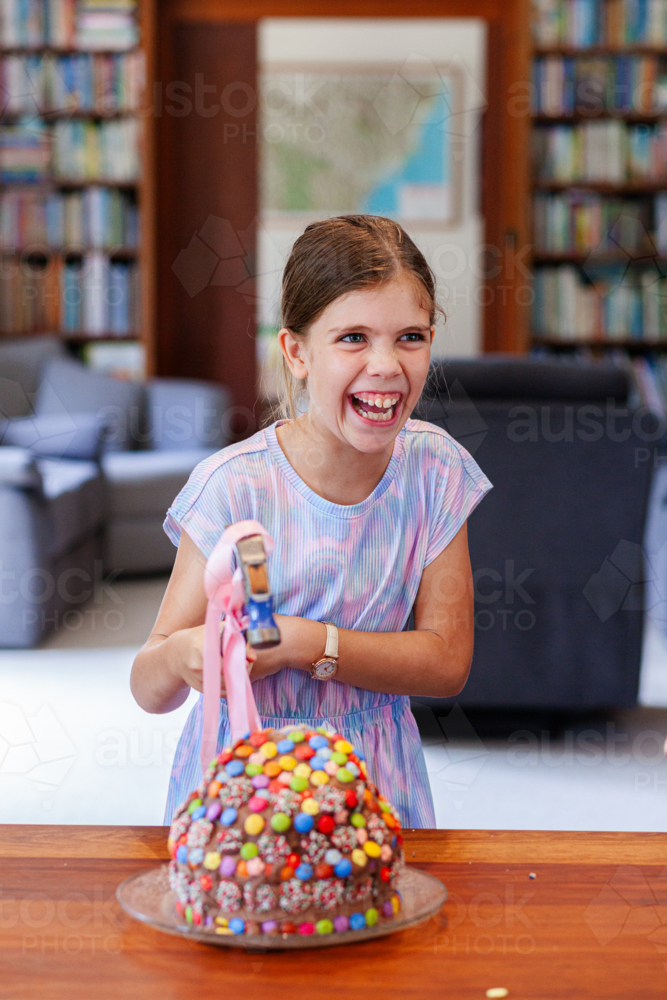smashing pinata chocolate birthday cake for tween childs birthday party - Australian Stock Image