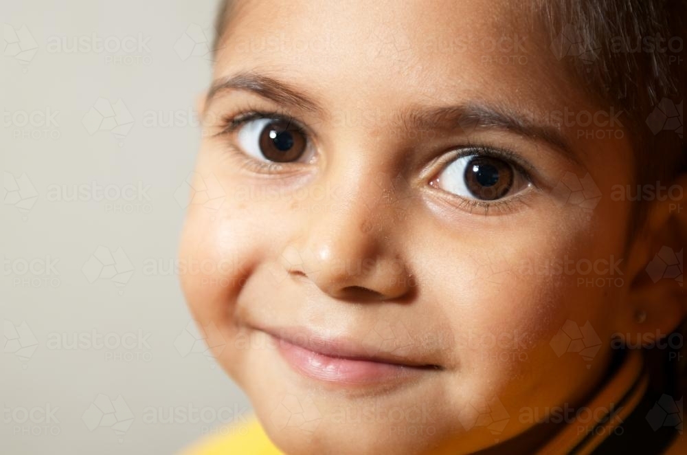 Smiling Aboriginal Boy in Close-up - Australian Stock Image