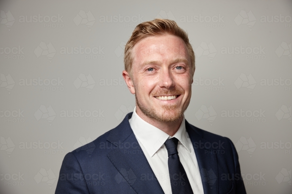 Smiling middle aged man wearing suit and tie - Australian Stock Image