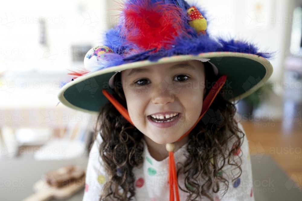 Smiling young girl with hand made Easter hat - Australian Stock Image
