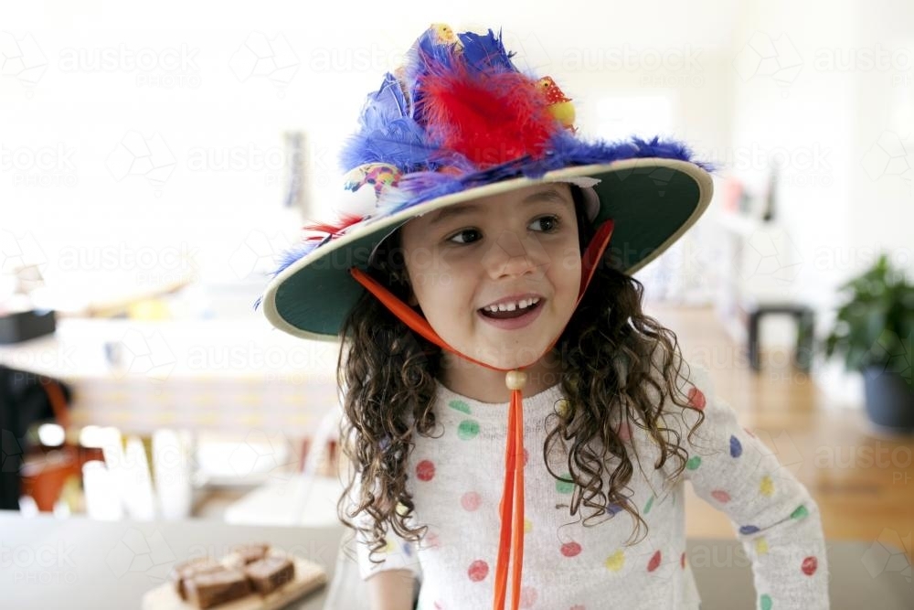Smiling young girl with handmade easter hat - Australian Stock Image