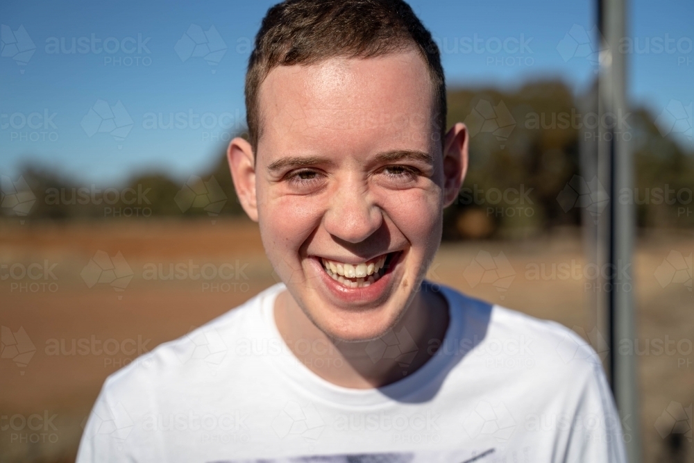 Smiling young man in the sunshine - Australian Stock Image