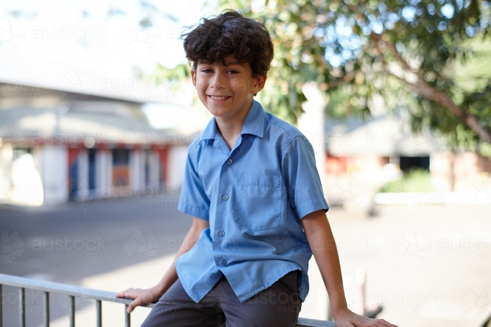 Smiling young school boy at school - Australian Stock Image