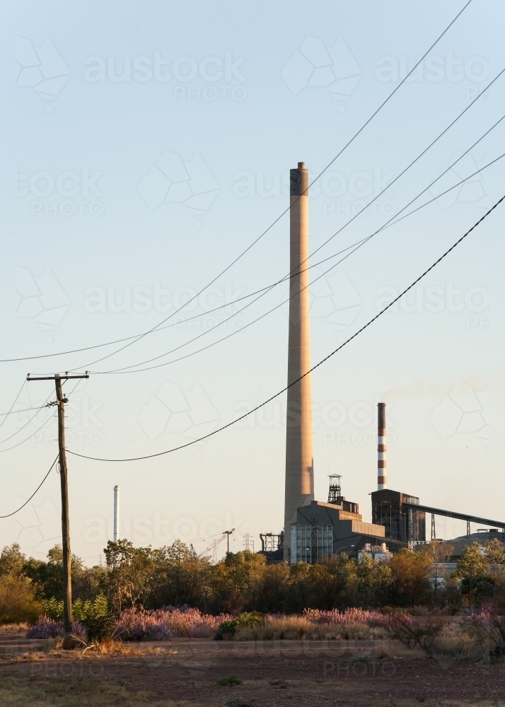 Smoke stacks and power lines in a mining town - Australian Stock Image