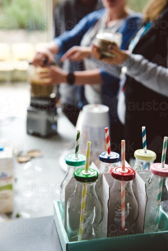Smoothie Making with Vintage Bottles and Straws - Australian Stock Image