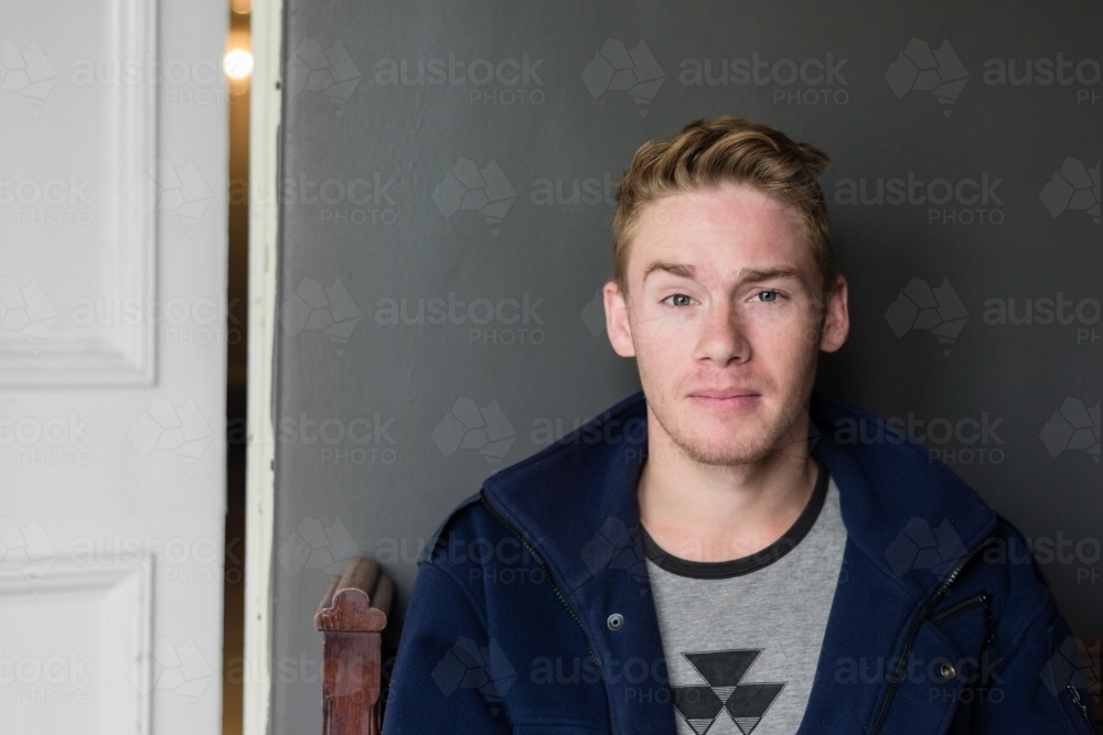 smug expression on a young man's face - Australian Stock Image