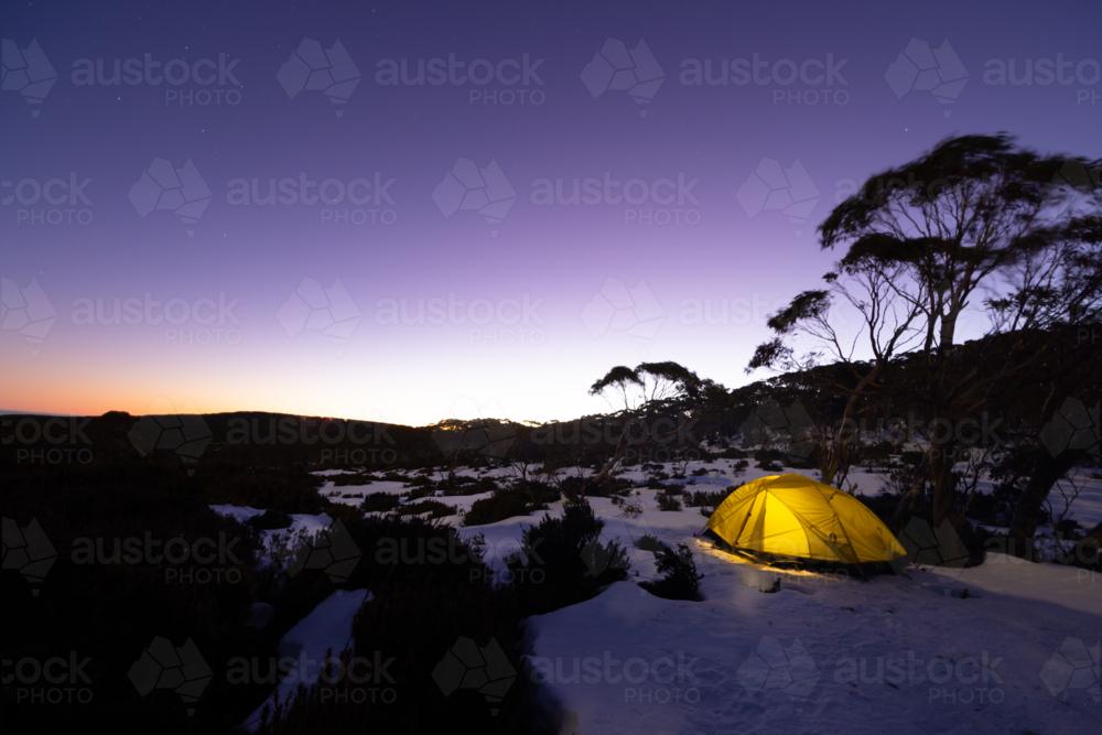Snow camping at Phillack Saddle, looking towards Mt Baw Baw at dusk on a cool winter's night - Australian Stock Image