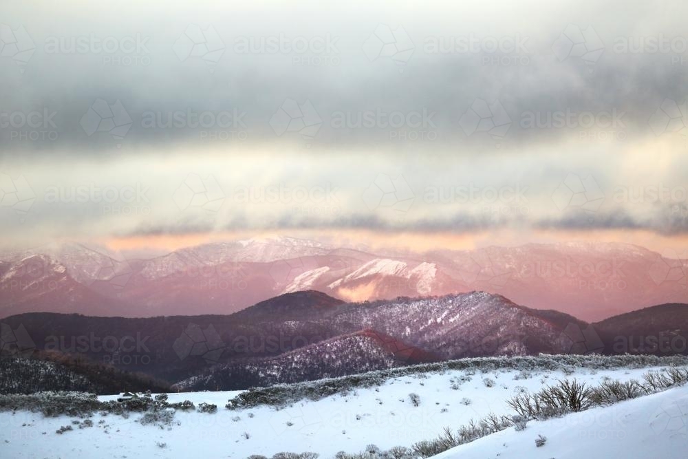 Snowy mountains at sunset - Australian Stock Image