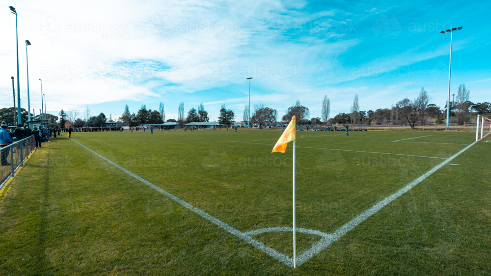 Soccer field corner with yellow flag. - Australian Stock Image