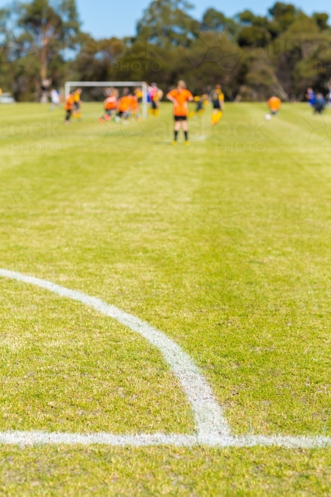 Soccer field with kids playing soccer - Australian Stock Image