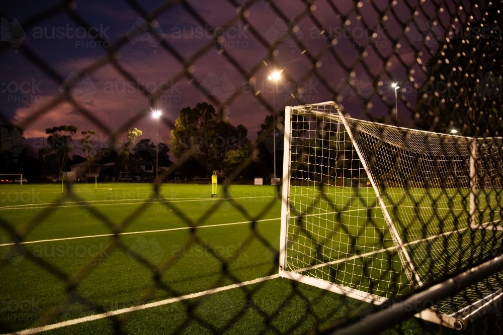 soccer goal and nets at night - Australian Stock Image