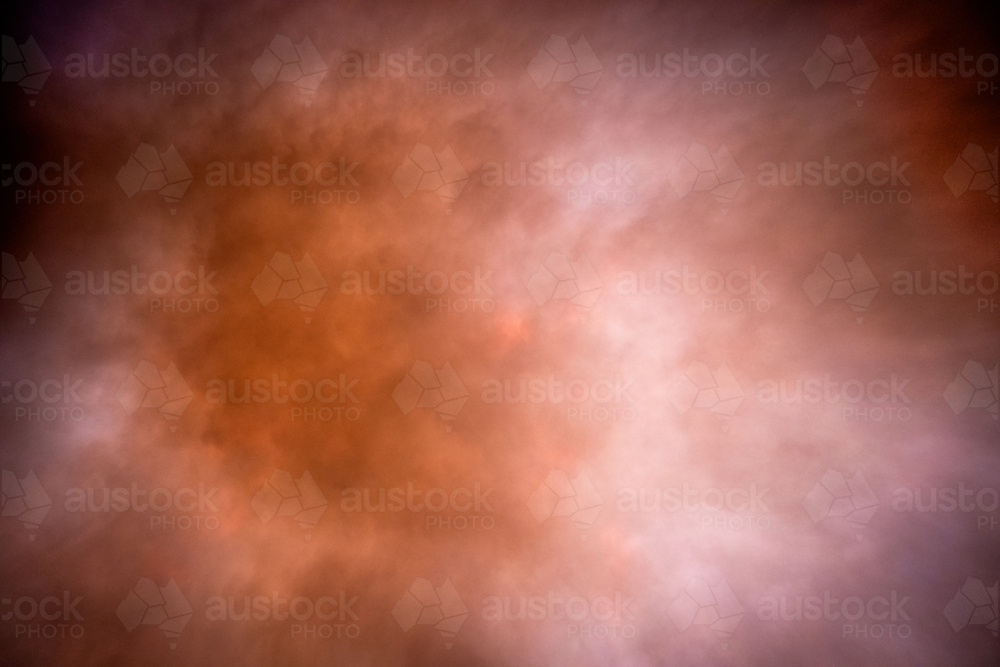Soft light through a dusty evening sky - Australian Stock Image