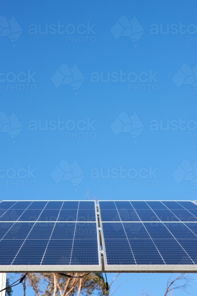 Solar panels against clear blue sky - Australian Stock Image