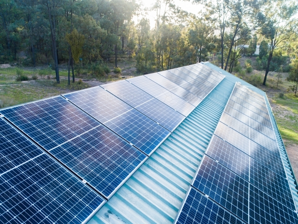Image of Solar panels installed on shed roof in country Austockphoto
