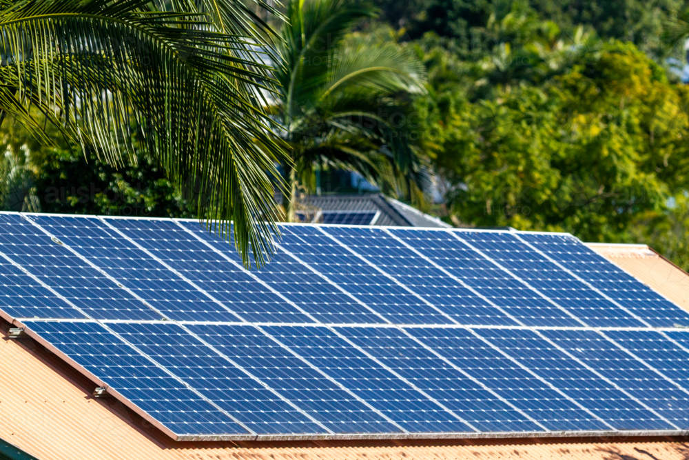Image of Solar panels on a suburban house roof - Austockphoto