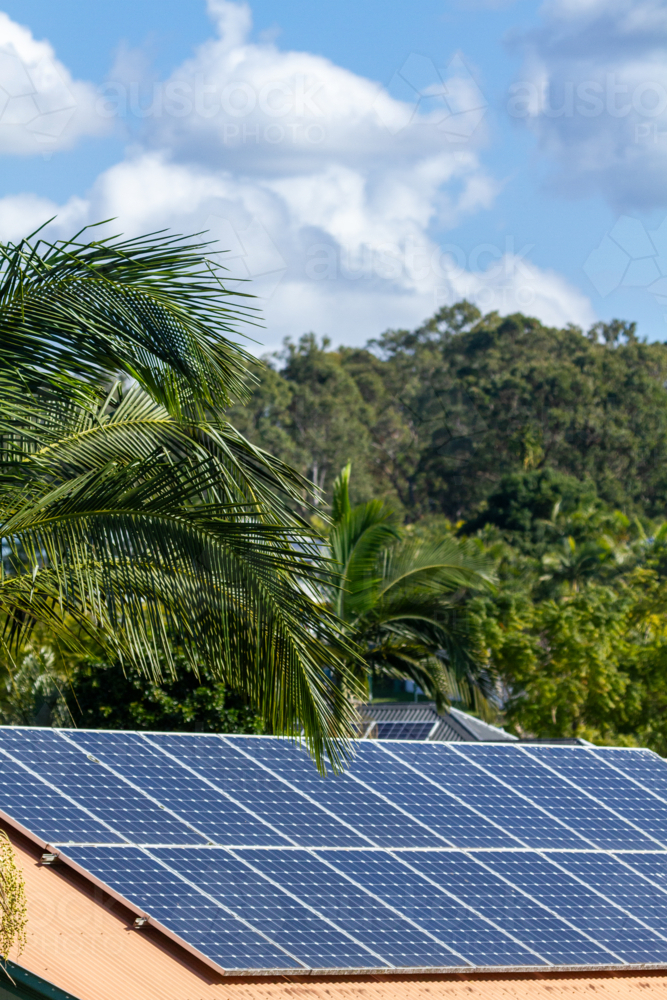 Image of Solar panels on a suburban house roof - Austockphoto