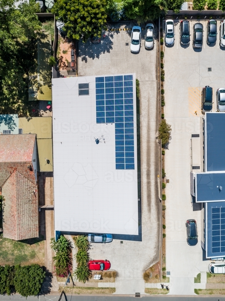Solar panels on roof of environmentally friendly business - Australian Stock Image