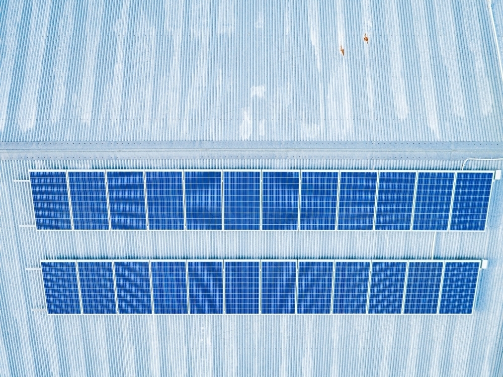 Solar Panels on tin roof of farm shed viewed from above - Australian Stock Image