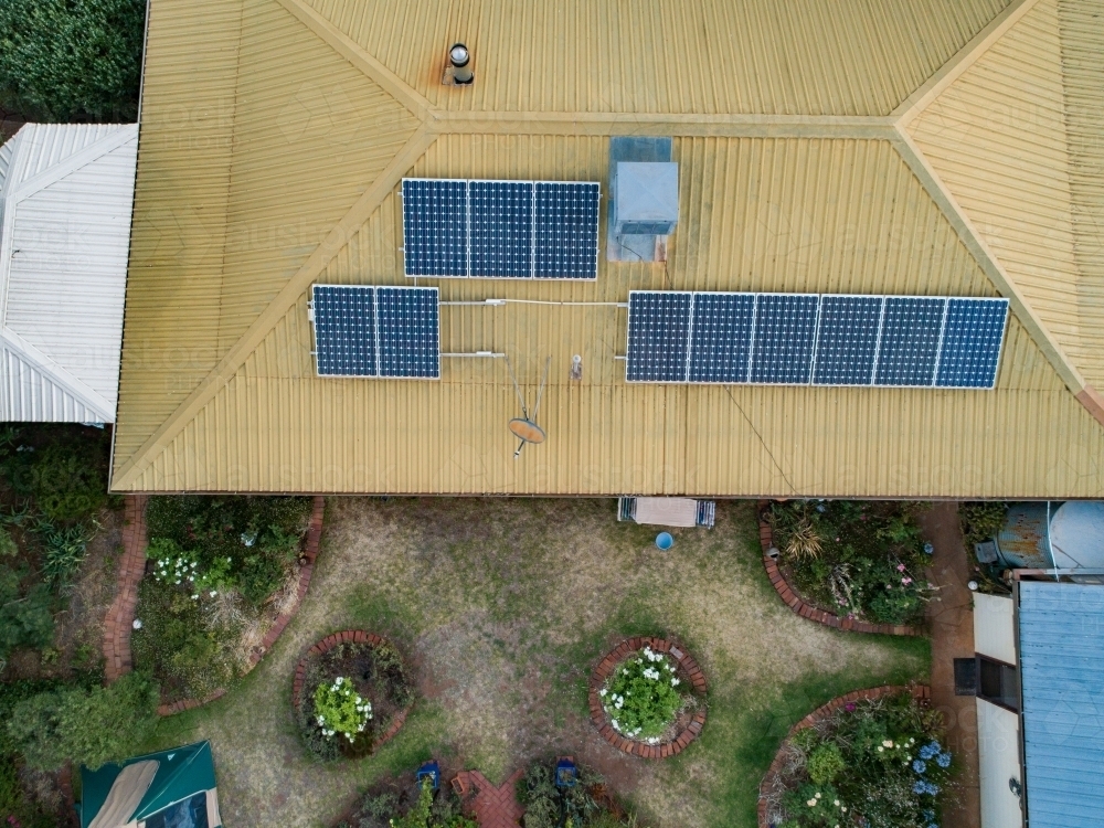 Solar panels on tin roof of town house - Australian Stock Image
