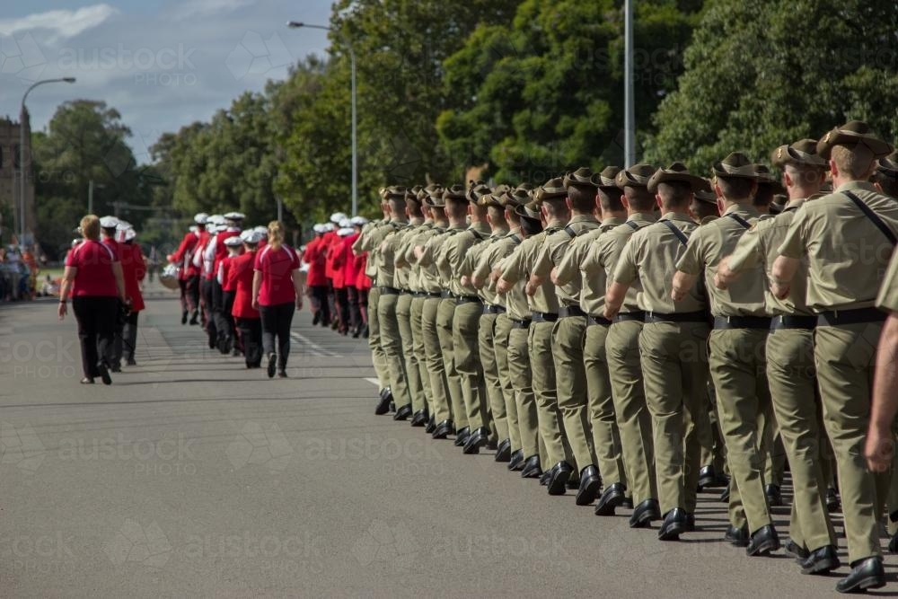 Soldiers and town band marching on ANZAC Day - Australian Stock Image